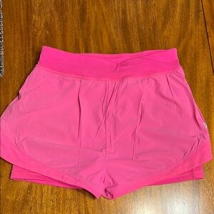 Sweaty Betty Pink Athletic Shorts with Wide Waistband and Curved Hem